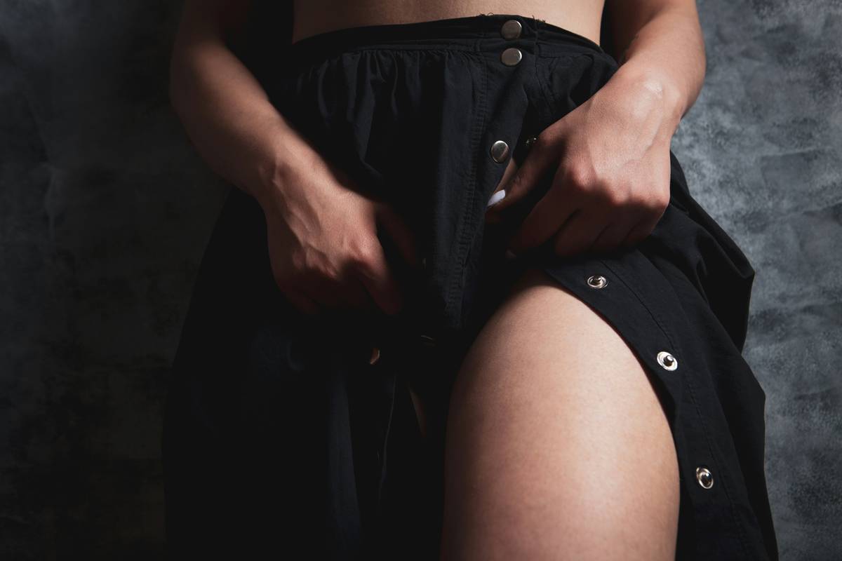 woman applying does b tight cellulite cream work treatment to thigh with dry brush nearby